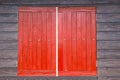 Red window brown wood wall. Royalty Free Stock Photo