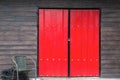 Red window brown wood wall. Royalty Free Stock Photo