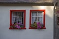 red windows with flowers - old buiding in Treis-Karden, Germany Royalty Free Stock Photo