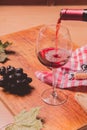 Red wine against wooden background Royalty Free Stock Photo