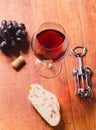 Red wine against wooden background Royalty Free Stock Photo