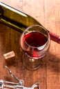 Red wine against wooden background Royalty Free Stock Photo