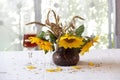 Red wine in a beautiful glass and a bouquet of sunflowers