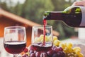 red wine being poured from bottle to glass Royalty Free Stock Photo