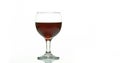 Red Wine being poured into Glass, against White Background Royalty Free Stock Photo