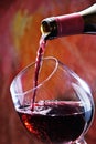 Red wine being poured into wine glass Royalty Free Stock Photo