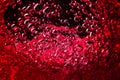 Red wine on black background, abstract splashing