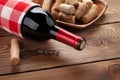 Red wine bottle, bowl with corks and corkscrew Royalty Free Stock Photo