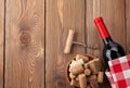 Red wine bottle, bowl with corks and corkscrew Royalty Free Stock Photo