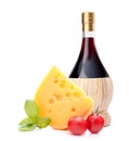 Red wine bottle, cheese and tomato still life Royalty Free Stock Photo