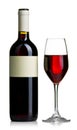 Red wine bottle with clear glass with red wine isolated