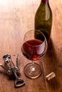 Red wine bottle, corks and corkscrew Royalty Free Stock Photo