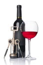 Red wine bottle with empty black label and glass for tasting with corkscrew Royalty Free Stock Photo