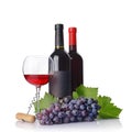 Red wine bottle with empty black label and glass for tasting with fresh grape and corkscrew Royalty Free Stock Photo