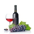 Red wine bottle with empty black label and glass for tasting with fresh grape Royalty Free Stock Photo