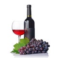 Red wine bottle with empty black label and glass for tasting with fresh grape Royalty Free Stock Photo