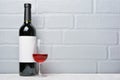 Red wine bottle with empty label and glass for tasting Royalty Free Stock Photo