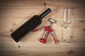 Red wine bottle, empty wine glass and corkscrew Royalty Free Stock Photo