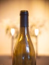 Table set with wine bottle and candle lit white lilies. Heart shaped bokeh Royalty Free Stock Photo