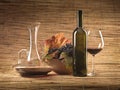 Red wine bottle, glass, grapes, decanter rustic Royalty Free Stock Photo