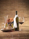 Red wine bottle, glass, grapes, decanter rustic Royalty Free Stock Photo