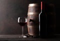 Red wine bottle, glass and old barrel Royalty Free Stock Photo