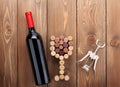 Red wine bottle, glass shaped corks and corkscrew Royalty Free Stock Photo