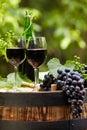 Red wine bottle and glass on wodden barrel