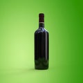 Red wine bottle green background