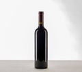 Red wine and a bottle isolated over white background Royalty Free Stock Photo