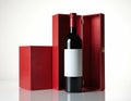 Red wine bottle in luxury gift box. Empty white label for custom text. Beverage packaging for special occasions and celebrations. Royalty Free Stock Photo