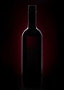 Red Wine bottle silhouette on red black background Royalty Free Stock Photo