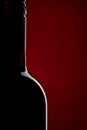 Red Wine bottle silhouette on red black background Royalty Free Stock Photo