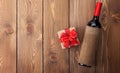 Red wine bottle and valentines day gift box Royalty Free Stock Photo