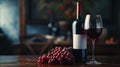 A red wine bottle with a white empty label, accompanied by a wine glass and grapes. The ambiance of wine culture and appreciation Royalty Free Stock Photo