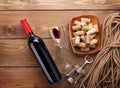 Red wine bottle, wine glass, bowl with corks and corkscrew Royalty Free Stock Photo