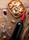 Red wine bottle, wine glass, bowl with corks and corkscrew Royalty Free Stock Photo