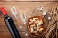 Red wine bottle, wine glasses, bowl with corks and corkscrew Royalty Free Stock Photo