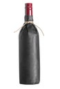 Red wine bottle wrapped in black paper Royalty Free Stock Photo