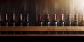 Red wine bottles displayed on a wooden shelf for winery, bar, or shop banner background Royalty Free Stock Photo