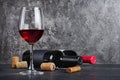 Red wine bottles with glass for tasting and corkscrew in cellar Royalty Free Stock Photo