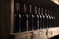 Red wine bottles on wooden shelf, created with generative AI Royalty Free Stock Photo