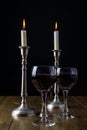 Red Wine with candles on wood table Royalty Free Stock Photo