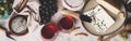 Red wine with charcuterie assortment on rustic concrete background