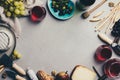 Red wine with charcuterie assortment on rustic concrete background