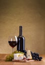 Red wine with cheese and blue grape snack Royalty Free Stock Photo