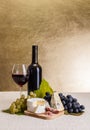 Red wine with cheese and blue grape snack Royalty Free Stock Photo