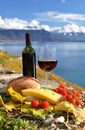 Red wine, cheese, bread and cherry tomatoes Royalty Free Stock Photo