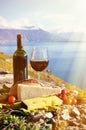 Red wine, cheese, bread and cherry tomatoes Royalty Free Stock Photo