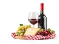 Red Wine, Cheese, and Grapes on a Red Gingham Tablecloth. Royalty Free Stock Photo